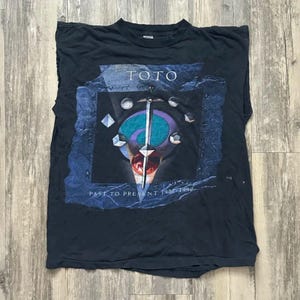 TOTO JAPAN TOUR 2023 ブラックワークシャツ TMG OFFICIAL WEBSITE | TOUR