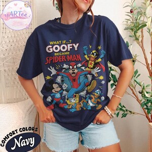 May include: Navy blue t-shirt with a graphic of Goofy as Spider-Man and other Disney characters. The text reads "WHAT IF...? GOOFY BECAME SPIDER-MAN". The shirt also has the words "COMFORT COLORS" and "Navy" printed on it.