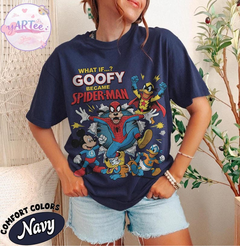 May include: Navy blue t-shirt with a graphic of Goofy as Spider-Man and other Disney characters. The text reads "WHAT IF...? GOOFY BECAME SPIDER-MAN". The shirt also has the words "COMFORT COLORS" and "Navy" printed on it.