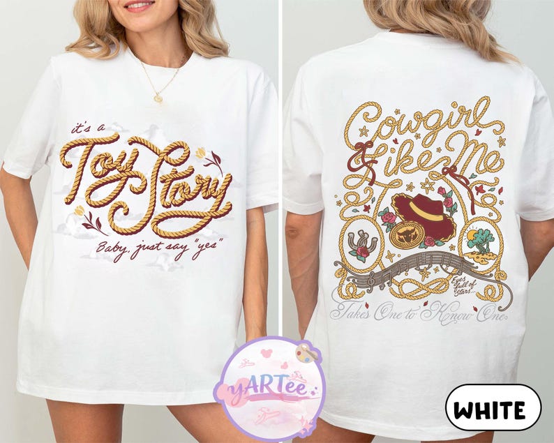 May include: A white t-shirt featuring a front graphic with the text "it's a Toy Story Baby, just say "yes"" in rope-style lettering. The back graphic displays "Cowgirl like Me" and "Takes One to Know One" with illustrations of a hat, horseshoe, and landscape.