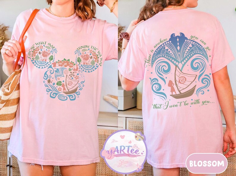 May include: Light pink t-shirt with a Disney-inspired design. The front features a Mickey Mouse head with floral and boat motifs, and the text "COME WHAT MAY" and "KNOW THE WAY". The back has a boat and the text "There is nowhere you can go that I won't be with you..."