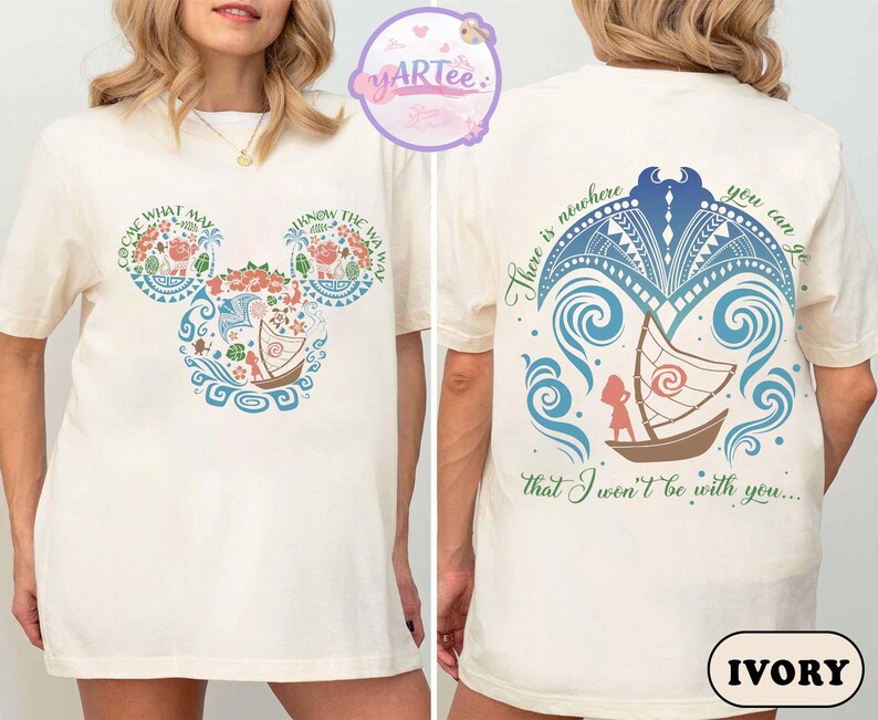 May include: Ivory-colored t-shirt featuring a colorful design inspired by a popular animated film. The front displays a Mickey Mouse-shaped design with floral and boat motifs, and text. The back features a boat scene with text. The shirt is a casual wear item.