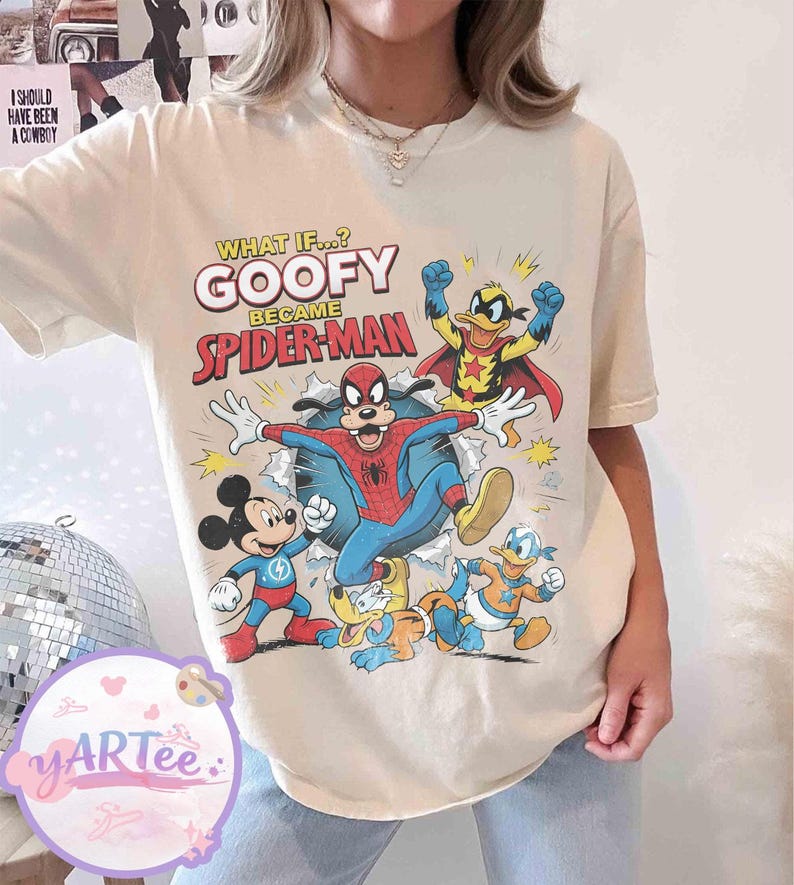 May include: Cream-coloured t-shirt with a graphic of Goofy as Spider-Man, alongside Mickey Mouse, Donald Duck, and Pluto. The text reads "WHAT IF...? GOOFY BECAME SPIDER-MAN". The shirt has a vintage, distressed appearance.