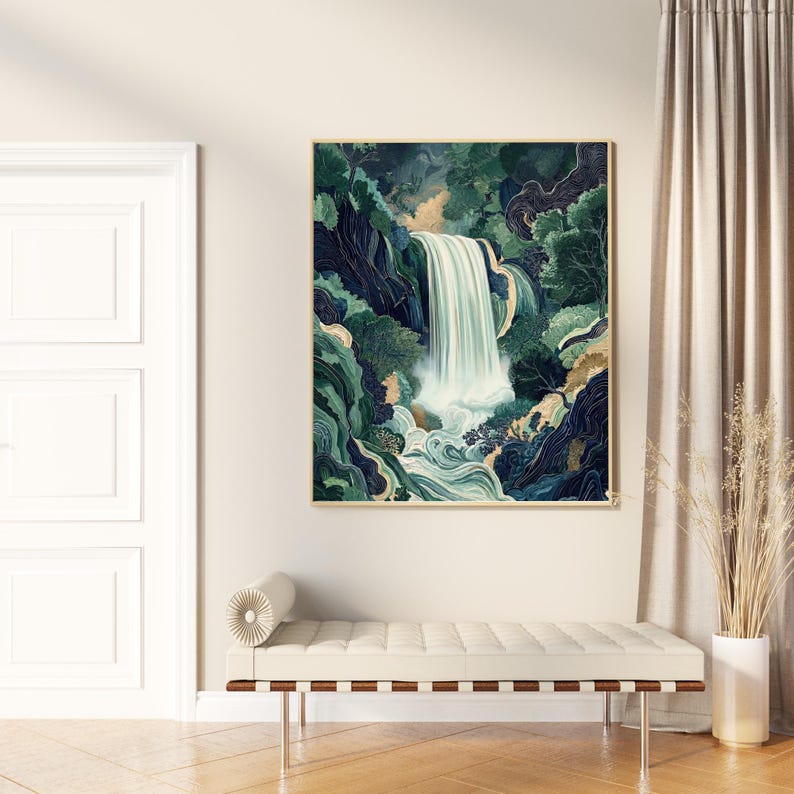Vertical Japanese waterfall wall art print displayed above a light wood bench in a neutral entryway, featuring a cascading white waterfall through deep navy canyon walls with emerald green foliage in a modern woodcut-inspired style.