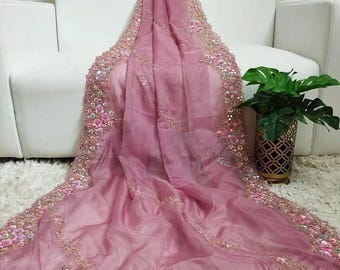 Exclusive pure sopura muslin floral party saree with zardosi work in lavender pink. Comes with blouse piece