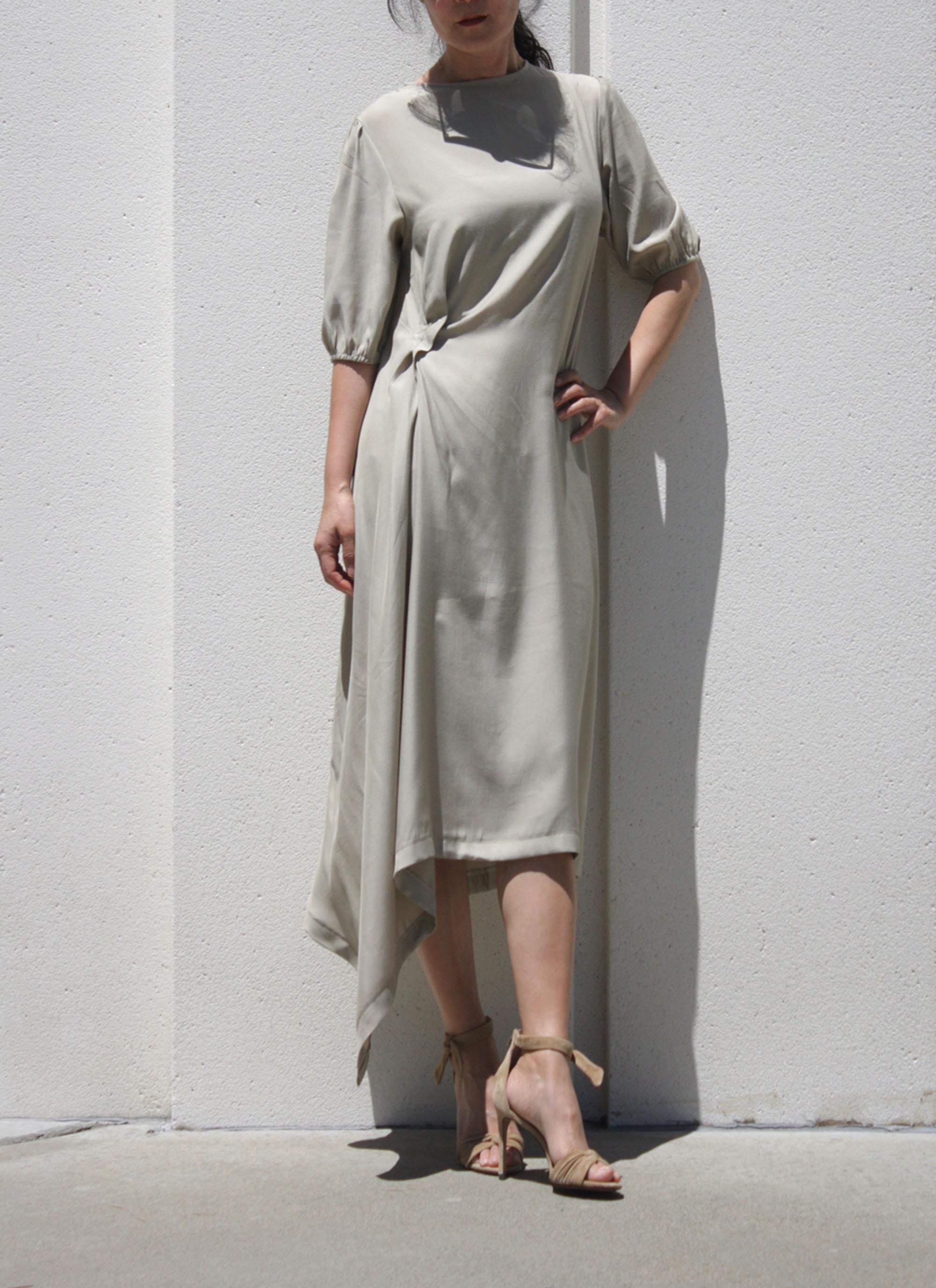 asymmetrical trim puff sleeve dress Midi Dress: Light Olive Silky Fabric Colors:Fuchsia White A portrait of fluid Category:FLORAL DRESSES Diablo Backless Mini Dress