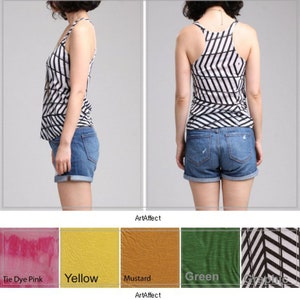 May include: A racerback tank top featuring a black and white geometric chevron pattern, paired with blue denim shorts. Below, color swatches display tie dye pink, yellow, mustard, green, and the black and white graphic pattern with the text ArtAffect.
