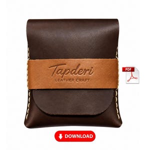 May include: A dark brown leather pouch with a flap closure, featuring a lighter tan leather band across the centre embossed with the text Tapderi LEATHER CRAFT. The pouch is stitched with thick light-coloured thread along the sides.