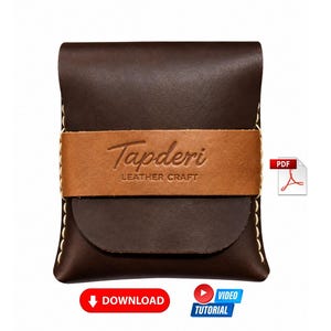 May include: A dark brown leather pouch featuring a horizontal tan leather strap embossed with the text Tapderi LEATHER CRAFT. The pouch is constructed with visible light-colored stitching along the sides and includes a PDF icon and two buttons labeled DOWNLOAD and VIDEO TUTORIAL.