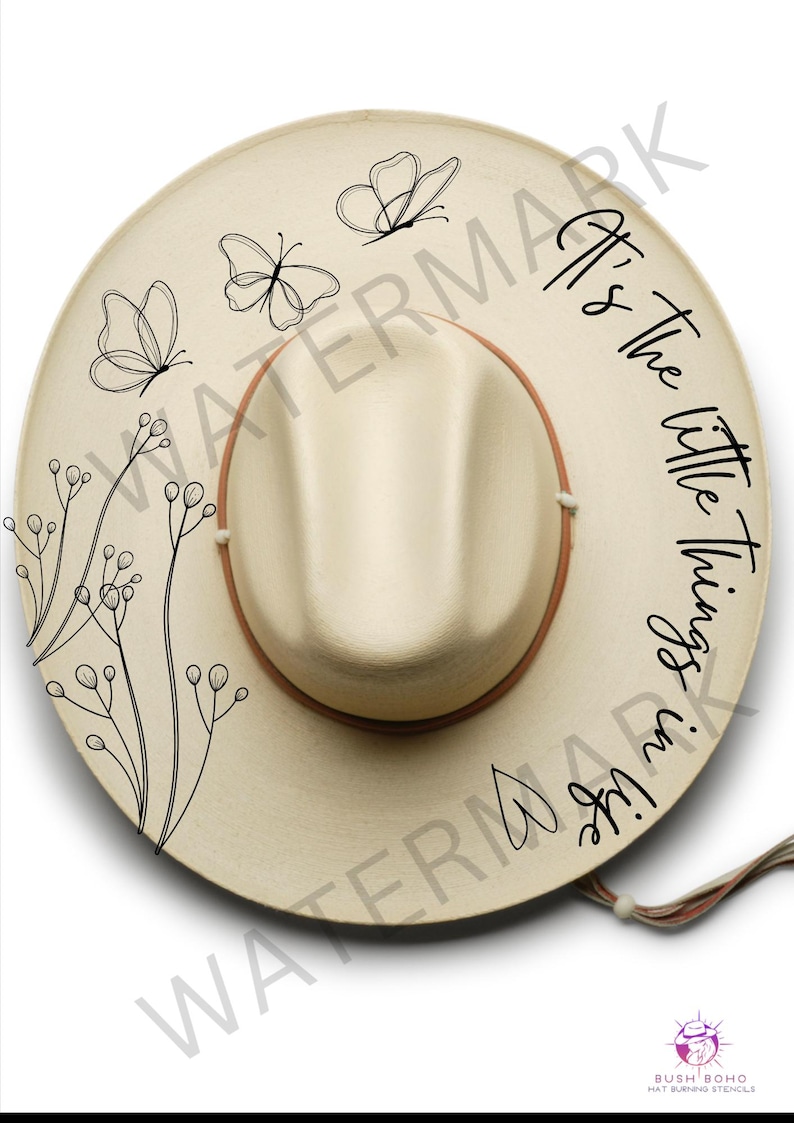 May include: A beige straw hat with a black butterfly design and the text "It's the little things in life."