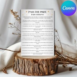 May include: A baby shower game card titled "Pass the Prize Baby Editions" on a wooden slice. The card has gold stars and text, with instructions for the game. A Canva logo is in the upper right corner.