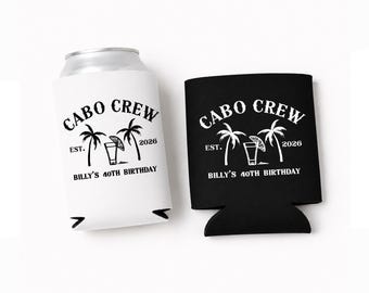 May include: One white and one black foam can cooler, each featuring the text CABO CREW, EST. 2026, and BILLY'S 40TH BIRTHDAY. The design includes a graphic of two palm trees flanking a drink glass with a lime wedge garnish on the front surface.