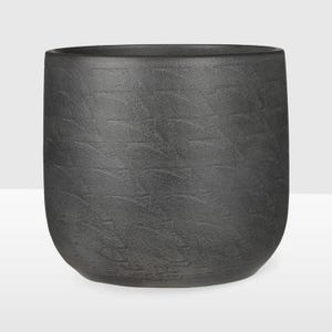 May include: A dark grey, cylindrical planter with a textured surface. The planter has a wide opening and a rounded base. The textured pattern is made up of small, repeating rectangular shapes. Suitable for indoor or outdoor use.