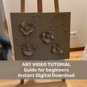 May include: A square, taupe-coloured artwork featuring raised, textured floral designs. The artwork is displayed on an easel. The text at the bottom reads: "ART VIDEO TUTORIAL Guide for beginners Instant Digital Download."
