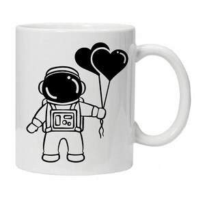 Taza de cerámica novedosa con astronauta y globos de corazón de amor, lavable y reutilizable, viene en caja para regalar