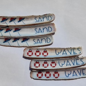Shell with sand and waves motifs.