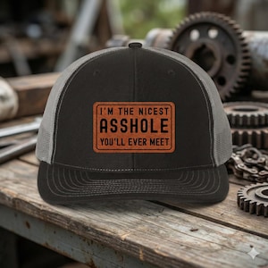 Im The Nicest Asshole Youll Ever Meet Trucker Hat, Richardson 112 Leather Patch Hat, Funny Work Hat, Dark Gray Mesh Snapback Cap