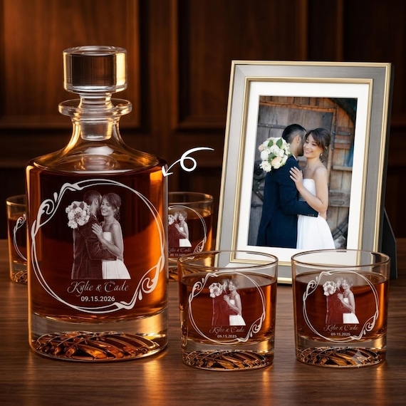 A custom photo etched directly onto a whiskey decanter with matching glasses is a genuinely impressive personalization technique — wedding photos on glassware you actually use is a step above the fridge magnet.