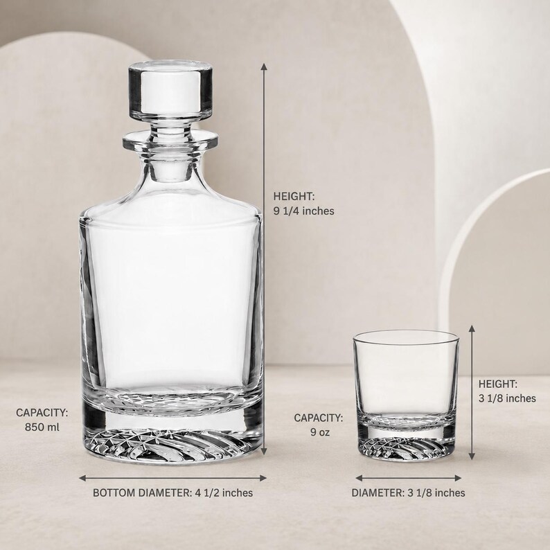 May include: A clear glass decanter with a stopper and a matching glass tumbler. The decanter is 9 1/4 inches high with a 4 1/2 inch bottom diameter and 850 ml capacity. The tumbler is 3 1/8 inches high, 3 1/8 inches in diameter, and holds 9 oz.