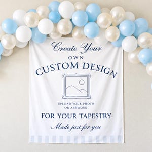 May include: A white rectangular fabric tapestry featuring dark blue text that reads Create Your Own CUSTOM DESIGN, UPLOAD YOUR PHOTO OR ARTWORK FOR YOUR TAPESTRY, and Made just for you, with a central line-art icon of a framed landscape.
