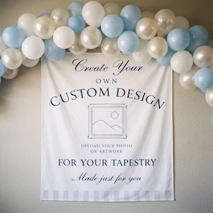 May include: A white rectangular fabric tapestry featuring dark blue text that reads Create Your OWN CUSTOM DESIGN, UPLOAD YOUR PHOTO OR ARTWORK FOR YOUR TAPESTRY, Made just for you, and a line drawing of a framed landscape, framed by a balloon arch.