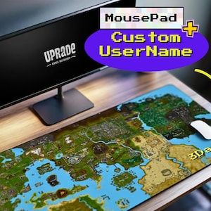 以下が含まれることがあります： 青い水と緑の陸地が特徴の、詳細な地図デザインのカスタムゲーミングマウスパッド。白いマウスがパッド上にあり、「3Dara4」の文字が見えます。モニターとウェブカメラも画像にあります。