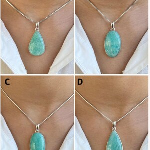 May include: Four silver necklaces featuring polished, light teal-green amazonite gemstones in various shapes. Options A and D display teardrop-shaped pendants, while B and C feature oval-shaped stones, all set in simple silver frames on silver chains.