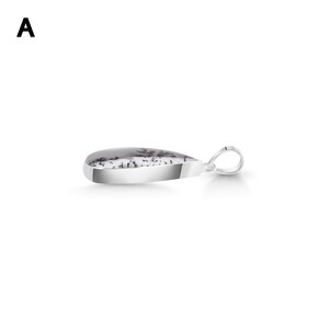 May include: A teardrop-shaped pendant featuring a white stone with black dendritic inclusions, encased in a polished silver-toned metal setting. The pendant includes a small, circular silver-toned bail attached to the top for hanging on a chain.