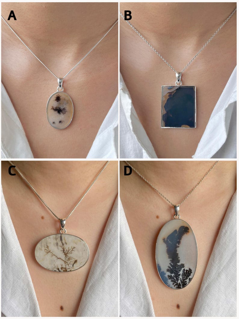 May include: Four silver necklaces featuring distinct pendants: A is an oval stone with dark inclusions, B is a rectangular dark blue stone, C is a horizontal oval stone with brown dendritic patterns, and D is a large vertical oval dendritic stone.