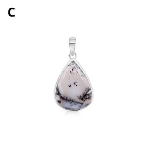 May include: A teardrop-shaped pendant featuring a smooth, pale pinkish-white stone with dark, branching dendritic inclusions. The stone is set in a polished silver-toned metal bezel with a matching silver-toned bail at the top for suspension.