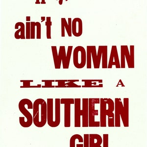 May include: Red text on a white background reads "Honey, ain't No WOMAN LIKE A SOUTHERN GIRL." The text is in a bold, blocky font. The words "Gossip" and "tender-heart press" appear in smaller text at the bottom of the image.