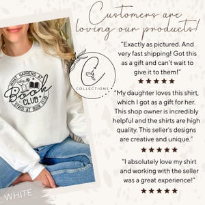 May include: White sweatshirt with the text "WHAT HAPPENS AT BOOK CLUB STAYS AT BOOK CLUB" in black. The design includes a cocktail glass, a book, and stars. The word "WHITE" is at the bottom.