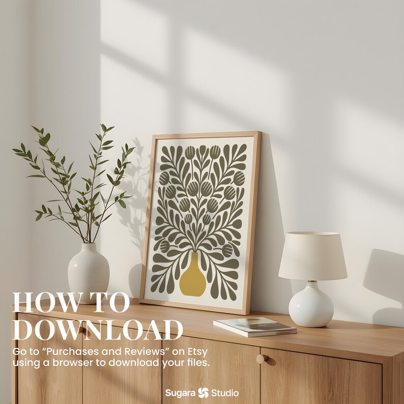 May include: A framed art print featuring a floral design in olive green and yellow, displayed on a wooden cabinet. A white vase with greenery and a small lamp are also on the cabinet. Text on the image reads "HOW TO DOWNLOAD".