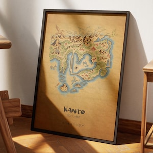 May include: A framed map of the Kanto region, featuring a detailed illustration of the landscape with mountains, forests, and water bodies. The map is in a black frame and has the word "Kanto" at the bottom.