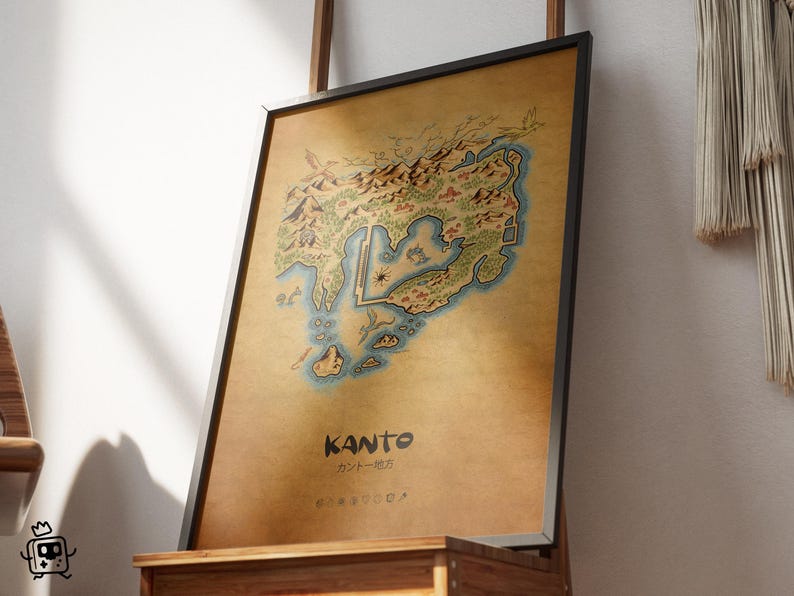 May include: Framed print of the Kanto region map, showcasing a detailed illustrated landscape with mountains, water, and landmarks. The print has a vintage aesthetic with a brown background and the word "KANTO" in bold text.