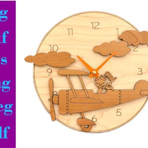 May include: Wooden clock with a light brown wood finish. The clock face features a white background with black numbers 1 through 12. The clock hands are orange. A wooden airplane with a girl pilot is attached to the clock face. The airplane is painted brown with black details. The clock is a great addition to a child's room.
