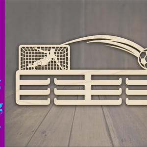 May include: A wooden soccer-themed trophy holder with a soccer ball in flight and a goalie diving to block a shot. The holder has multiple slots for medals. The image also includes the file type options: SVG, DXF, EPS, PNG, JPEG, and PDF.