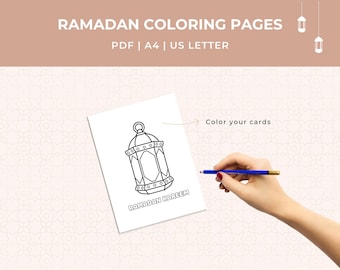 May include: White paper with a black outline of a lantern design, with the words "RAMADAN KAREEM" at the bottom. The text "RAMADAN COLORING PAGES" is at the top. A hand holds a blue pencil, ready to color the card.