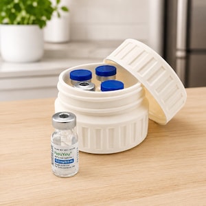 May include: A white, cylindrical container with a removable lid, holding several small vials with blue and silver caps. A single vial with the text "NeuYeu" is in front of the container. The vials are for subcutaneous use.