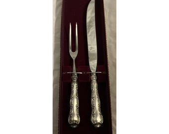 Juego de trinchar asados con mangos de plata esterlina Strasbourg by Gorham con caja original.