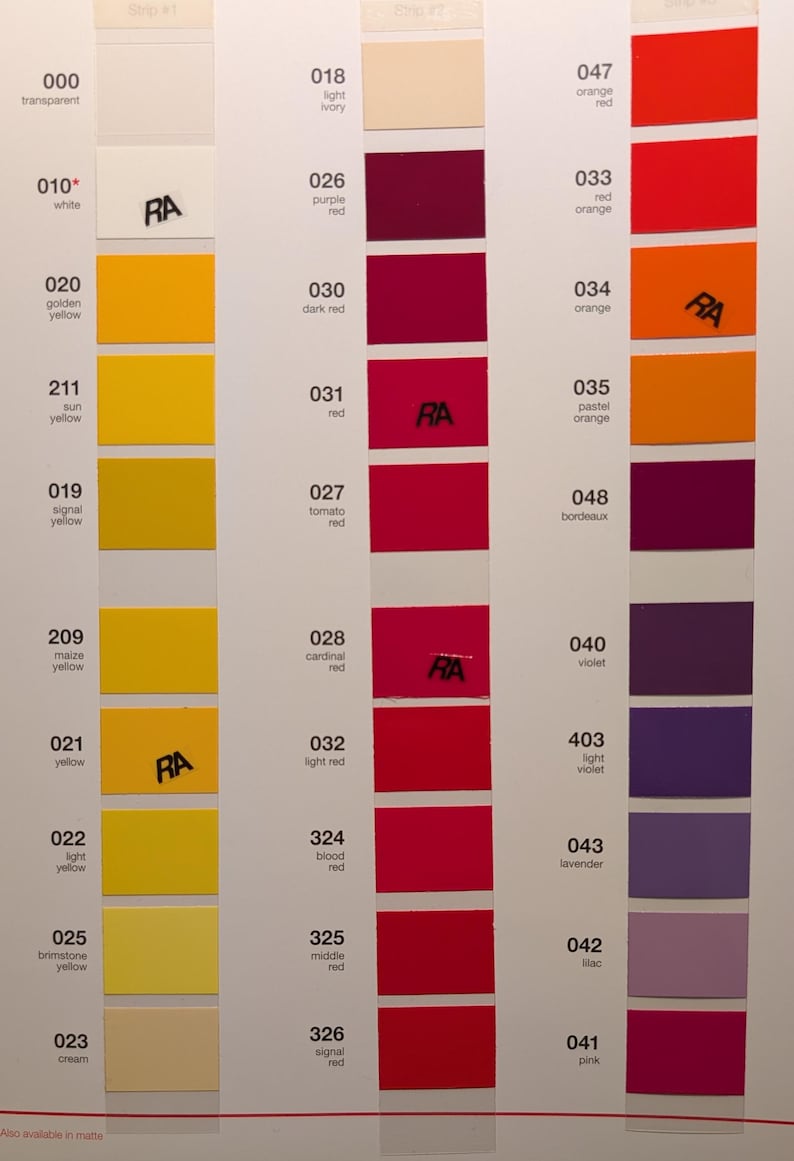 May include: Color swatches arranged in vertical columns, showcasing a range of hues from yellow to red and purple. Each swatch is labeled with a number and color name, with some including the letters "RA". The image is a color chart.