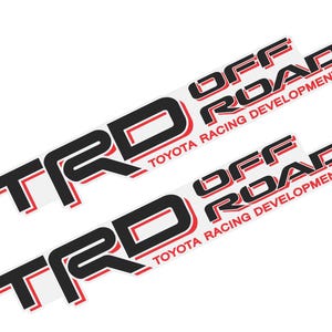 May include: Two white rectangular stickers featuring the text "TRD" in black and red, and "OFF ROAD TOYOTA RACING DEVELOPMENT" in black and red. These stickers are designed for off-road vehicles.