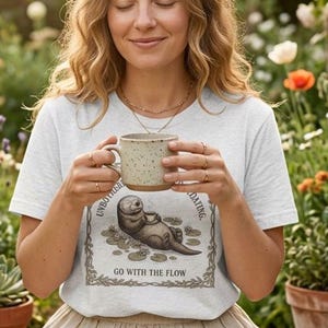 Unbothered Moisturized Floating Shirt, Funny Otter Tee, Go With The Flow Shirt, Cottagecore Animal Graphic Tee, Funny Nature Shirt