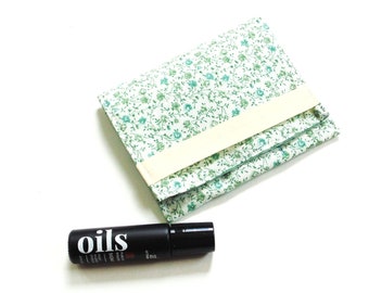 Small essential oil pouch for traveling, holds 3 roller ball bottles, green floral