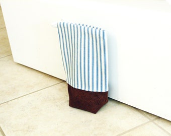 Fabric doorstop with zipper closure, unfilled door weight, blue ticking stripes