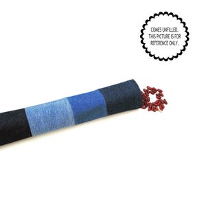 May include: A denim-style bolster pillow in shades of blue and black, with a section of red beans next to it. The pillow is divided into three sections of varying blue hues. Text on the image reads: COMES UNFILLED. THIS PICTURE IS FOR REFERENCE ONLY.