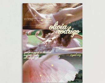 May include: A rectangular poster featuring a collage of blurred figures in pink tulle skirts on a green lawn. The text reads olivia rodrigo, you seem pretty sad for a girl so in love, you're a spark in the dark and my clothes all caught aflame, stupid song, released june 12 2026, with small yellow stars.
