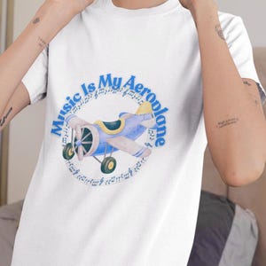 Koszulka z samolotem muzycznym | Koszulka z grafiką vintage z motywem lotniczym dla mężczyzn i kobiet | Koszulka dla miłośników podróży i muzyki