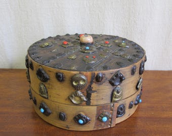 19th century Tibetan Buddhist bentwood box with applied brass relief panels of skulls and seated Buddhas with glass turquoise and coral