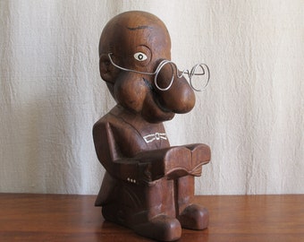3D caricature of an unknown sitter or character, seated reading with a bulbous nose, suit with tails, glasses, c. 1930 vintage antique